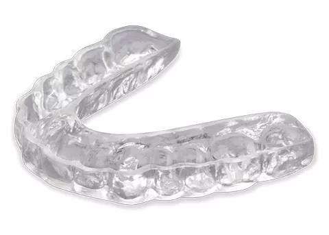 Clear dental aligners displayed against white background for orthodontic treatment.