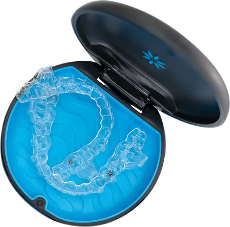 Clear dental retainer case with blue interior holding transparent orthodontic retainers